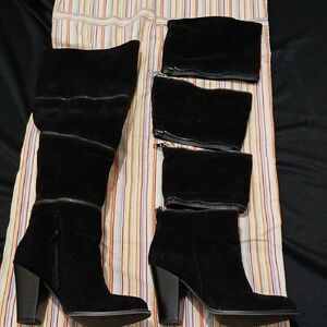 Sleek Black Heeled Boots with Segmented Design